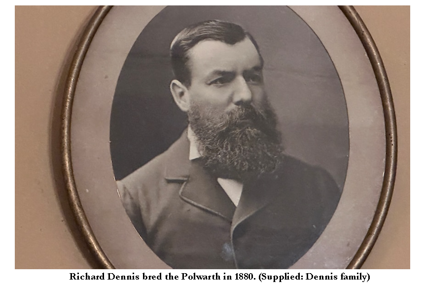 A black and white photo of a man with a long, dark beard.